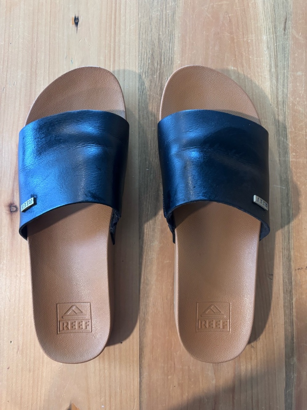 Reef Black Strap Slide Sandals with Brown Footbed